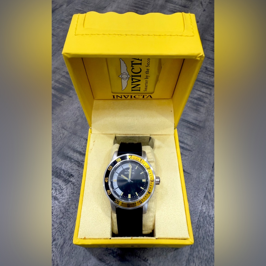 Invicta Silver And Yellow Timepiece